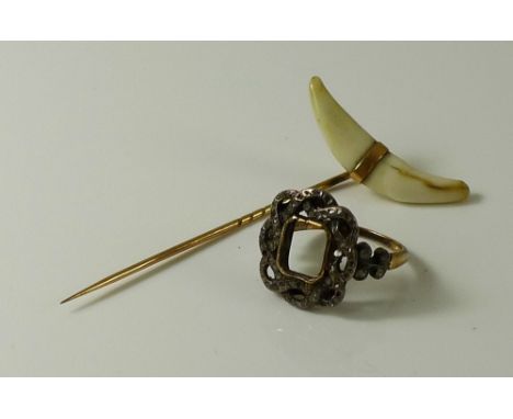 A 19th century gold and diamond rope twist ring, the open set rectangular frame with open twist setting studded with old cut 