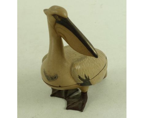 A Japanese lacquer kogo (incense box) in the form of a pelican, Meiji period, 19th century, modelled standing with it's head 