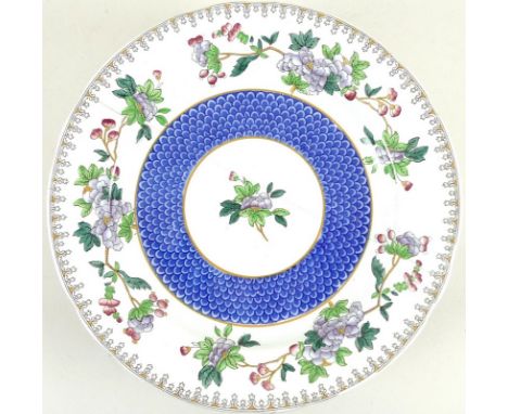 A set of twelve Copeland Spode plates, for Ovington Brothers, each decorated with a band of fish scale in cobalt blue, surrou