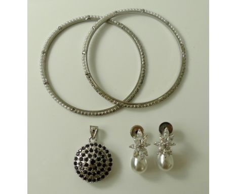 A silver and sapphire pendant, the stones set in concentric circles, 6.7g, together with a pair of simulated pearl drop earri