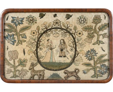 A 17th Century Stumpwork Embroidery in a later stand, depicting King Charles II and his wife Catherine dressed in fashionable