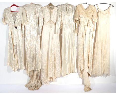 Assorted Early 20th Century Silk and Lace Wedding Gowns, comprising a long sleeved dress with collar, black and cream wriggle