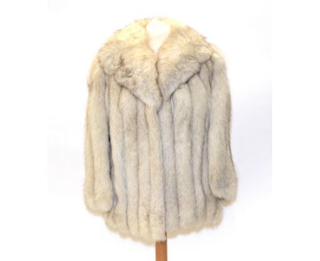 A Ross Furriers Leeds Arctic Fox Fur Jacket, with light grey leather inserts between the pelts, side pockets, shawl type coll