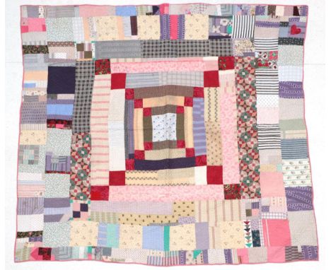From the Estate of Hannah Hauxwell (1926-2018) Large Late 19th Century Cotton Patchwork Quilt, with central square of blue fl