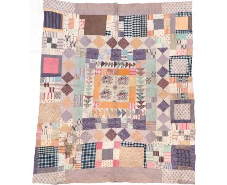From the Estate of Hannah Hauxwell (1926-2018) Late 19th Century Cotton Patchwork Quilt, with central square of four floral b