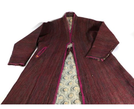 Mid 20th Century Quilted Cotton Chapan, with red and navy cotton fine stripes to the outside, edged in fushcia pink wool embr