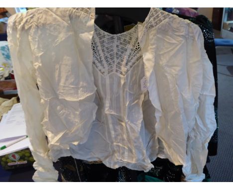 Early 20th Century Dresses, comprising a cream silk short sleeved wedding dress with floral appliquéd net mount to the bodice
