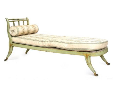 A Regency green painted and bamboo day bed, with scrolling back on swept supports and castors, 177cmW Provenance: from the es