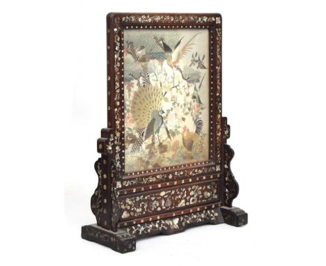 A 19th century Chinese Hongmu mother of pearl inlaid table screen on stand inset with a silk panel depicting fowl within a la
