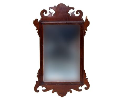 A Georgian fret carved mahogany veneered rectangular wall mirror, 58x32cmProvenance: from the estate of Elizabeth Pepys-Cocke