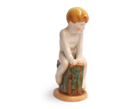 'Sea-Urchin', a mid 20th century Royal Worcester figure modelled by Margaret Cane as a naked boy seated on a grassy knoll, no