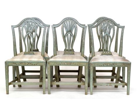 A set of six George III green painted dining chairs, each with slip in seat and pierced splat, on square tapered legs joined 