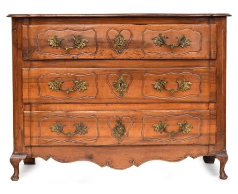 A French 'provincial' walnut serpentine fronted chest, probably 18th century, of three long panelled drawers on typical form,