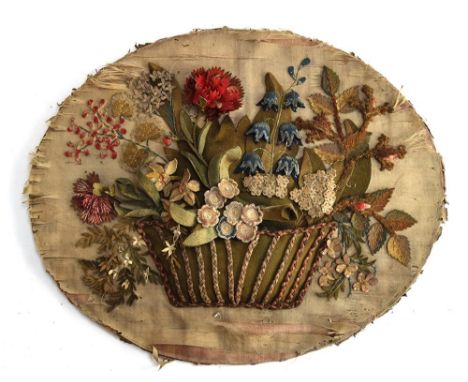 A late Georgian oval applied collage of felt flowers in a basket, in contemporary frame (silk worn), 52cmWProvenance: from th