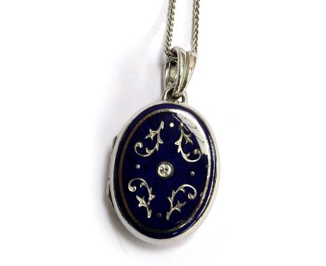 A modern FABERGE 18ct locket (stamped 750) with blue enamel decoration &amp; central diamond set with chain, marked 129/300 &