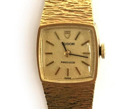 A LADIES 9CT GOLD TUDOR PRECISION BRACELET WATCHCIRCA 1970, gold coloured textured dial, baton markers, straight black hands,