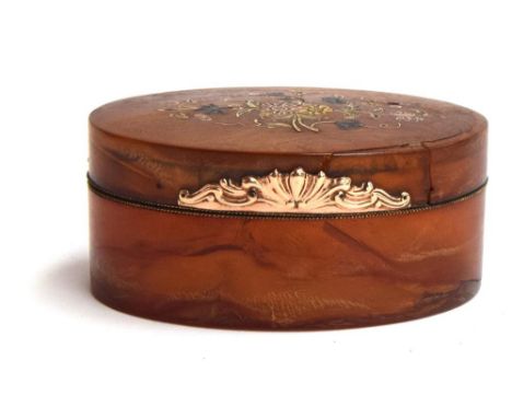 An 18th century blonde tortoiseshell oval box, the hinged cover with coloured gold piqué spray of flowers, chased gold thumbp