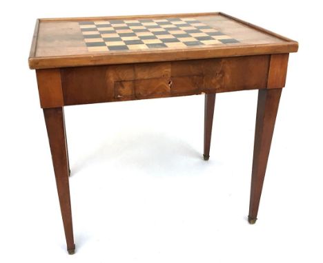An 18th century French chess table, the board of inlayed ebony, with raised moulded edge, the top lifting to reveal backgammo