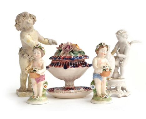 A group of ceramic figures to include a putto with crown impressed to base, 14cmH; another decorated with vines and grapes, d