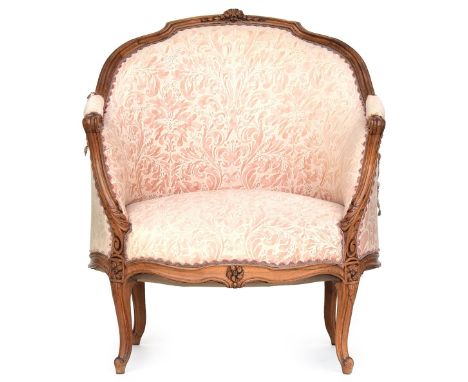 A 19th century Louis XV style carved beech bergere, on cabriole legs covered in pink and white chintzProvenance: from the est