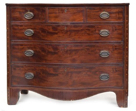 A George III Scottish mahogany serpentine fronted chest, with three short and three long drawers, with canted inlaid corners,