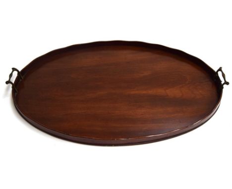 An oval two handled mahogany trayProvenance: from the estate of Elizabeth Pepys-Cockerell, whose husband John was a descendan