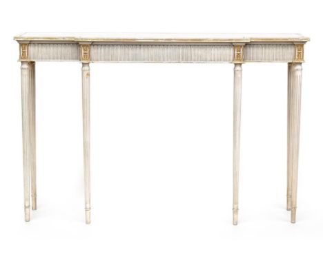 A 20th century white painted and parcel gilt break front side table, in the neoclassical style, on fluted tapering legs, 140x
