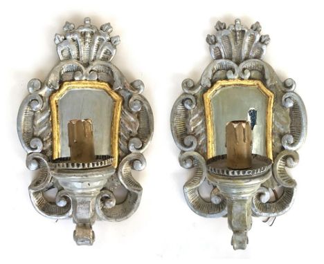 A pair of Italian parcel gilt and silver gesso wall sconces, fitted for electricity, each 59cmHProvenance: from the estate of