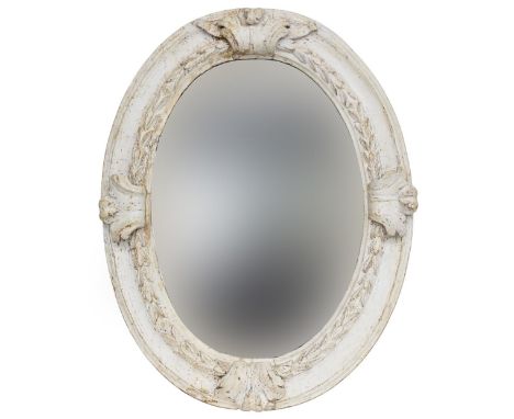 An 18th century Italian white painted oval mirror, the later plate within a concave and laurel frame with four acanthus leave
