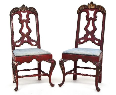 A pair of Venetian late 18th century scarlet lacquer and rocaille carved parcel gilt side chairs, with pierced splats, slip-i