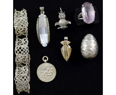 A group of silver and white metal  jewellery including an early 20th C panel bracelet, a ring set with a large amethyst, silv