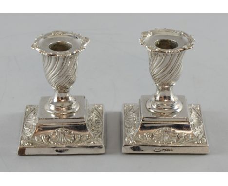 Pair of Victorian silver dwarf candlesticks with shell and scroll decoration, by Harrison Brothers & Howson, Sheffield, 1897/