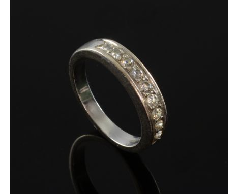 Diamond half eternity ring, nine round brilliant cut diamond in a claw setting mounted in white metal tested as 18ct. Total d