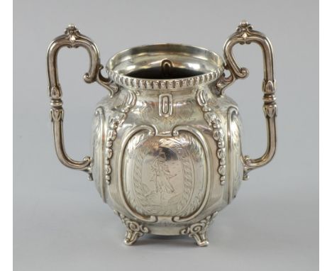 Victorian silver urn shaped vase set on four feet  with four panels, one depicting a maiden, by Roberts and Slater, Sheffield