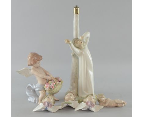 Lladro lamp in form of a young boy,  30cm  a cherub holding flowers, and four christmass decorations.  Provenance:  Deceased 