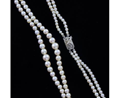 Double row of graduated cultured pearls to a white gold clasp set with small diamond