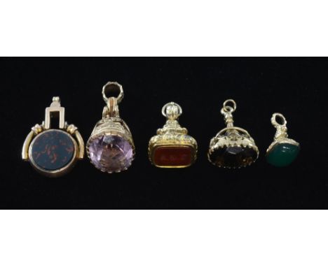 Five fob seals, four gold and one gilt metal Set with amethyst, bloodstone, quartz and intaglio cut carnelian,