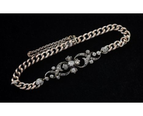 Edwardian diamond set bracelet, the central panel comprising of open scroll work set with old cut diamonds Silver and gold mo