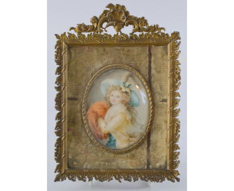 Late 19th/early 20th century portrait miniature depicting a young woman in a blue hat with fur muffler, signed Zita, 8.5cm x 