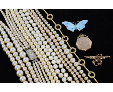 A  cultured pearl necklace, seed pearl set brooch an enamel butterfly and three faux pearl and a paste necklace
