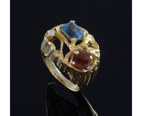 Blue topaz, diamond and hessonite garnet ring  in naturalistic setting, stamped 750 for 18 ct gold.