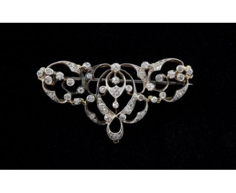 Edwardian diamond set openwork brooch, silver and gold mounted, estimated total diamond weight 0.50cts Provenance; from the f