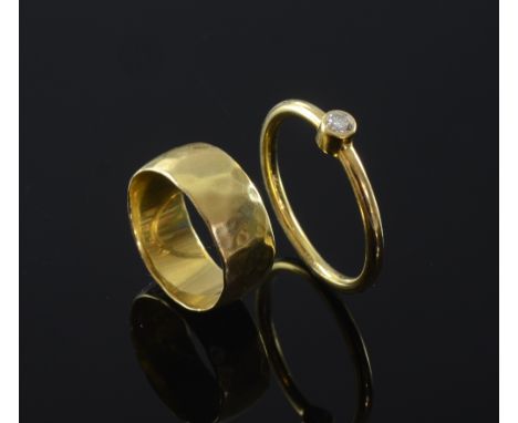 Single stone diamond ring weighing 0.15cts in 18ct yellow gold and a 18ct yellow gold band ring