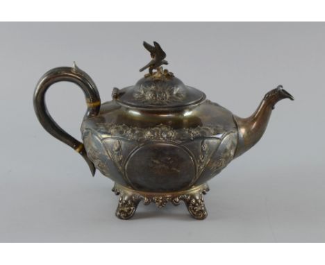 Victorian silver teapot with embossed decoration on four scrolling feet, by Robert Harper, London, 1875, 30oz, 933g,