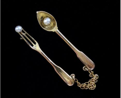 Faberge, a spoon and fork brooch by workmaster Erik Kollin, (1836-1901) gold and pearl, St Petersburg, Russia  C 1890 56 stan