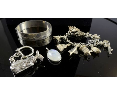 Silver charm bracelet, silver pencil holder, bangle and a white metal key ring
