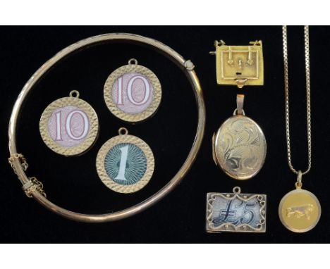 Gold hinged bangle, six charms with bank notes a fine chain bracelet and a locket all 9ct gold