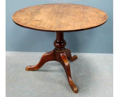 George III oak circular tripod table with tilt top action, 74cm high, diameter 98cm