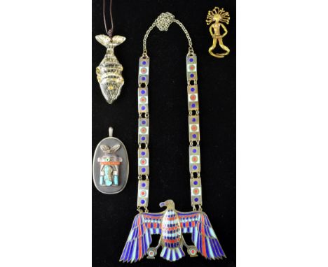 A group of 1970's jewellery including a large silver pendant with a styalised tribal figure, Inlaid turquoise and coral signe