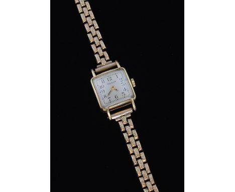 Tissot ladies gold dress watch, maunual winding 14 ct case, on a 9ct bracelet strap